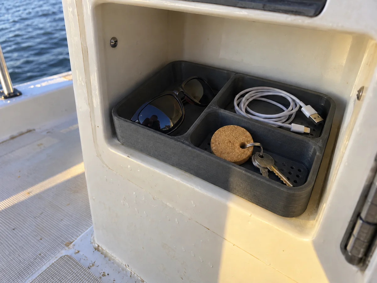 Compartment organizer fitted into a boat console